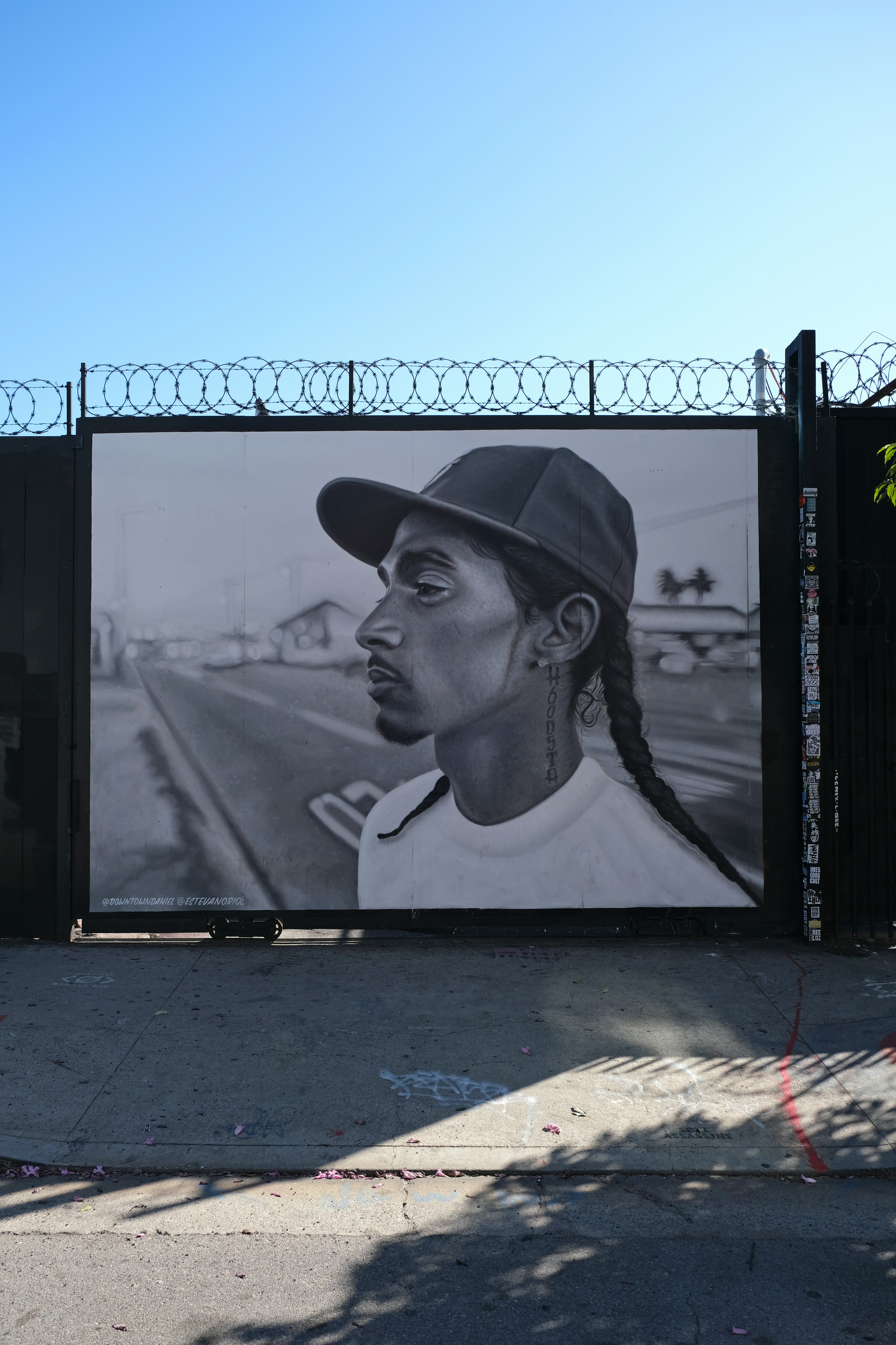 black flat screen tv turned on displaying man in black hat